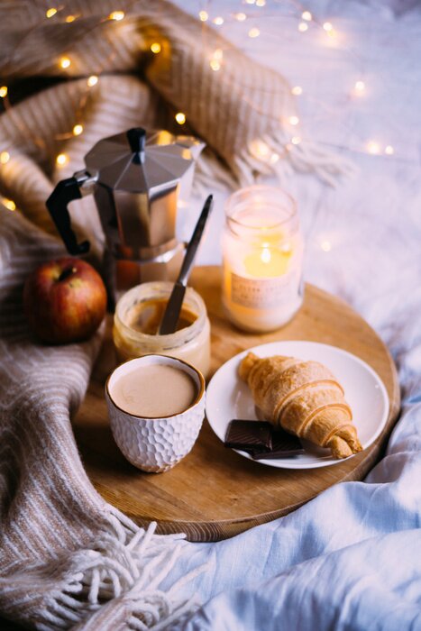 cozy winter weekend breakfast coffee and croissant on wooden tray 700 182972399